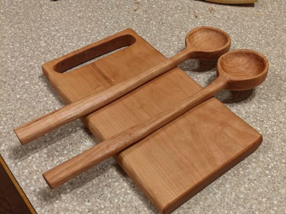 Cherry salad serving spoons and cutting board